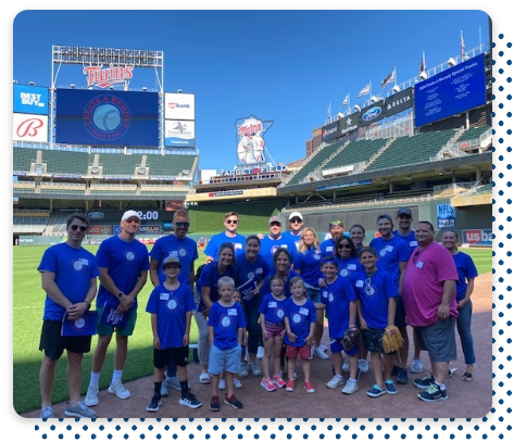 An image of the Center team at a baseball game volunteering